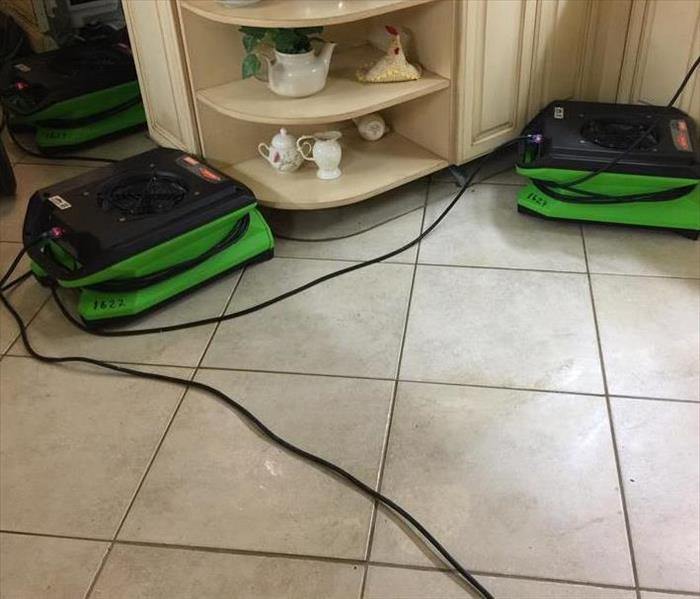 SERVPRO equipment removing mold and restoring the kitchen