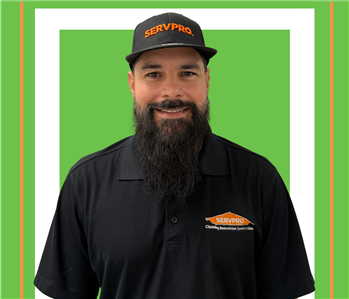 A SERVPRO employee is shown in a black shirt with SERVPRO logo